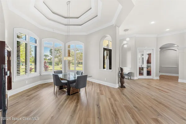 a bedroom with a large bed and a large window