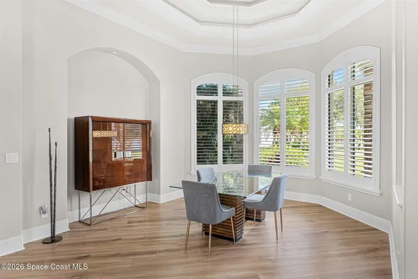 a spacious bathroom with double vanity a bathtub a mirror a vanity and a shower