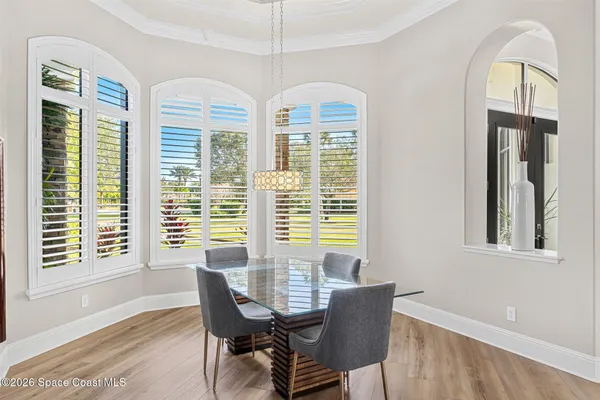 a spacious bathroom with a tub sink shower and a mirror