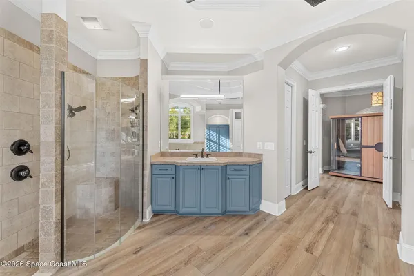 a bathroom with a granite countertop sink and a large mirror