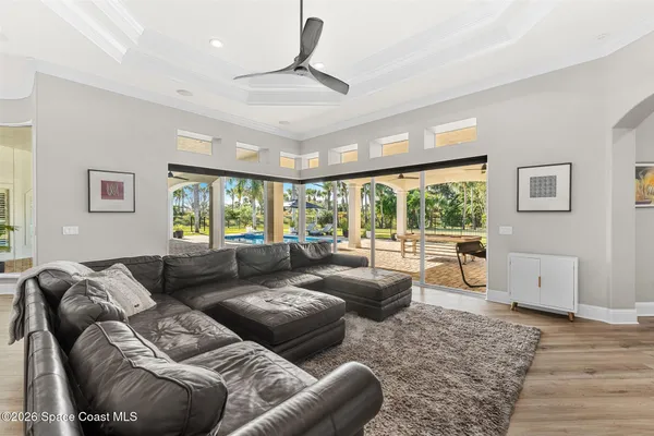 a bathroom with a granite countertop sink and a toilet
