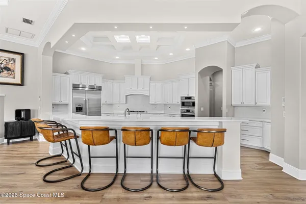 a utility room with sink dryer and washer