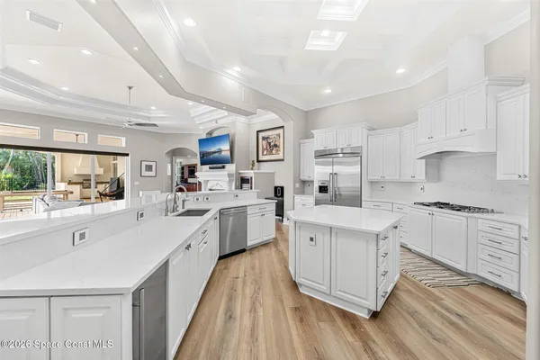 a view of a house with backyard porch and sitting area