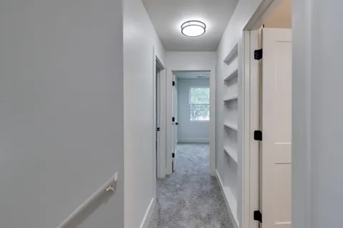 wooden floor with a hallway