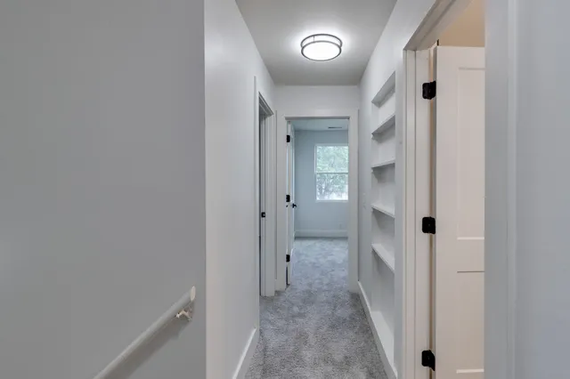 wooden floor with a hallway