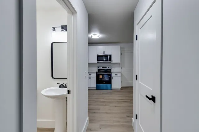 a bathroom with a sink double vanity and a mirror
