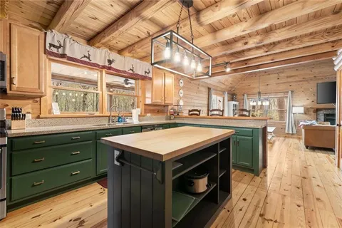a kitchen with stainless steel appliances a stove a refrigerator and a sink