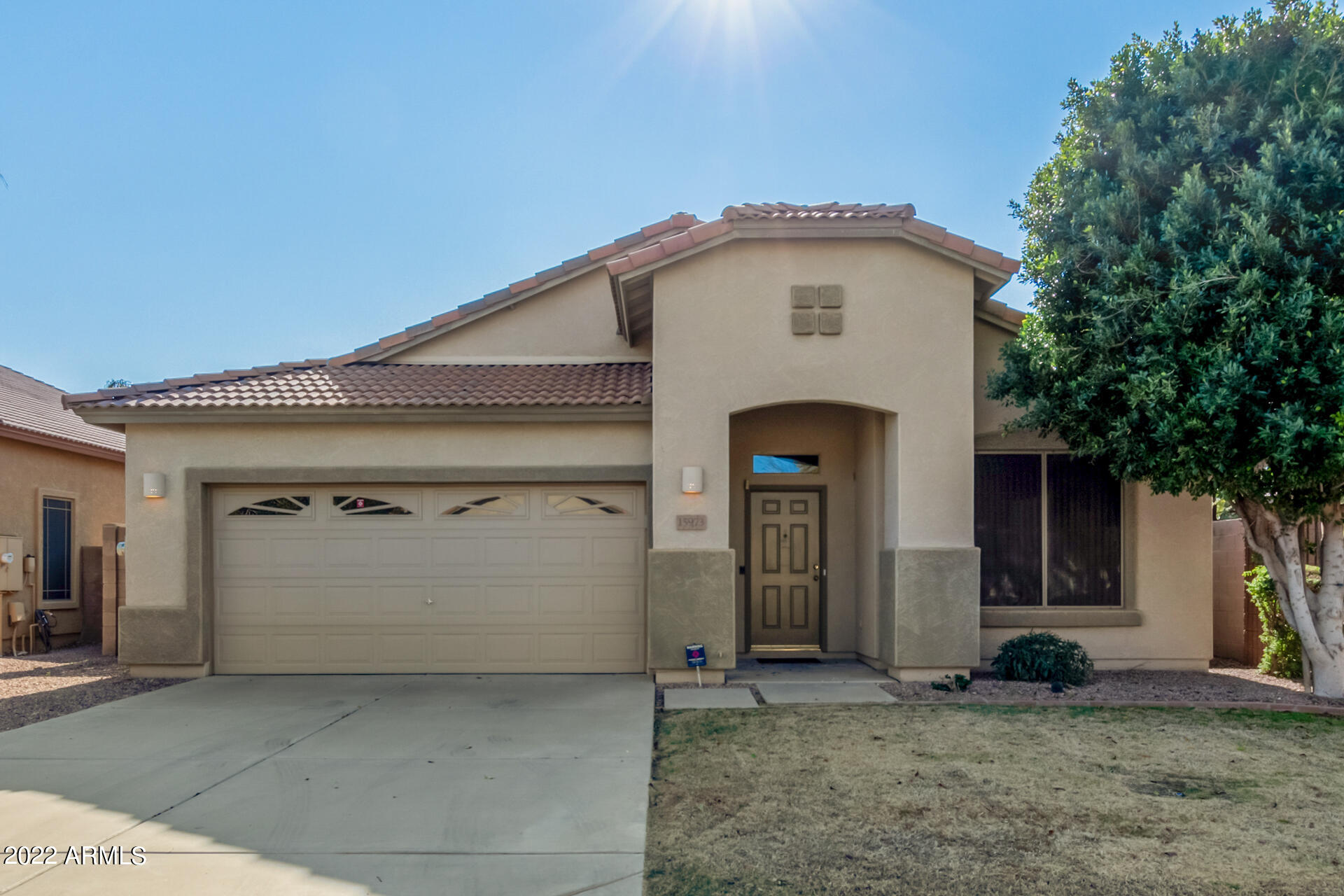15973 West Calavar Road Surprise, AZ 85379 - Photo 1 of 27 a front view of a house