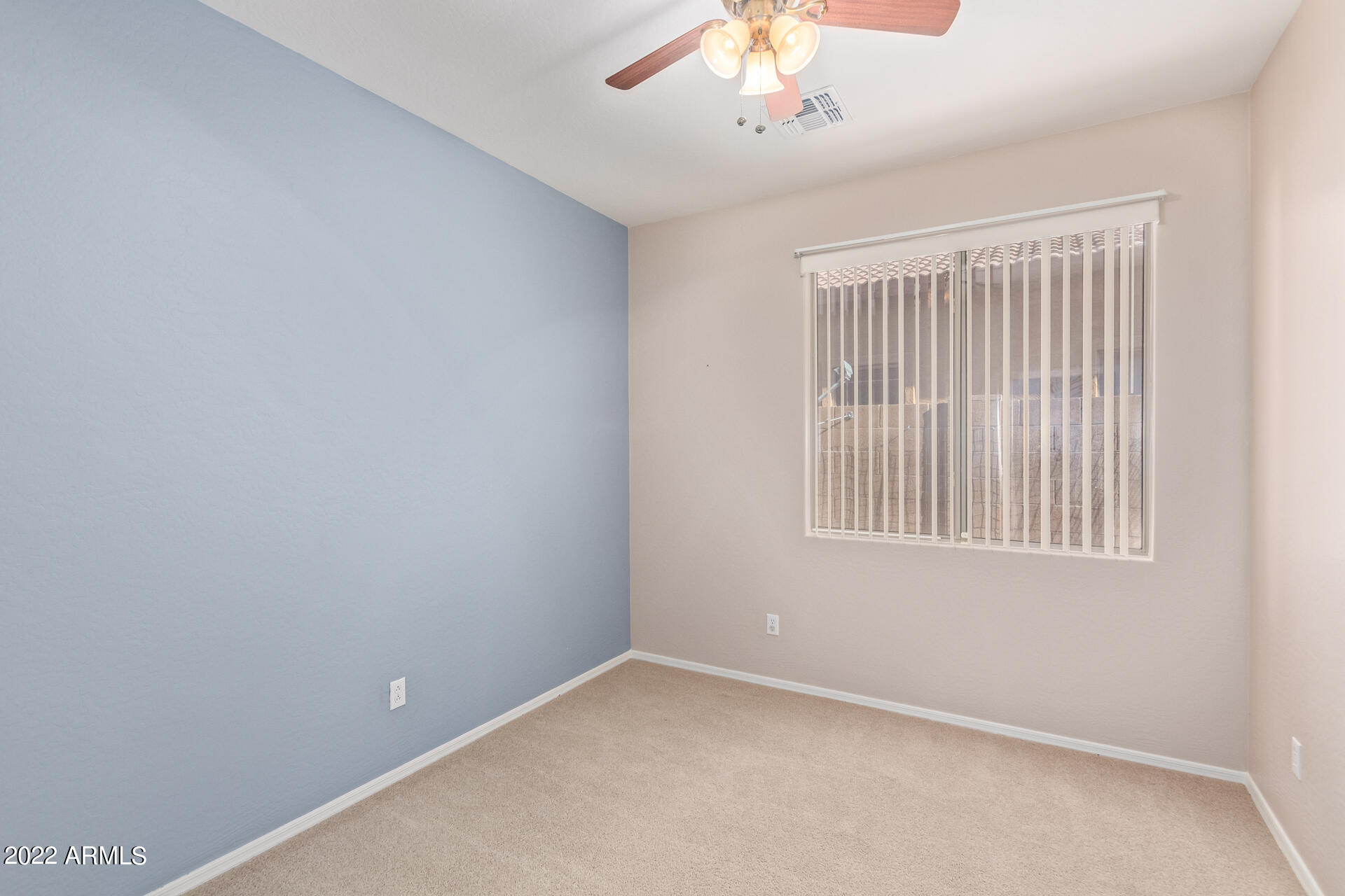 15973 West Calavar Road Surprise, AZ 85379 - Photo 19 of 27 an empty room with a window