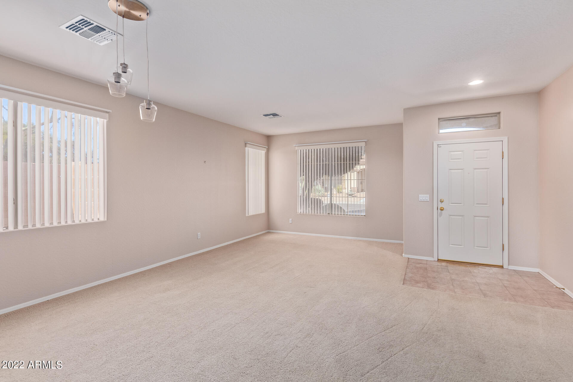 15973 West Calavar Road Surprise, AZ 85379 - Photo 4 of 27 a view of an empty room with a window