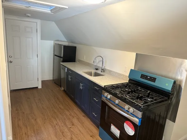 a kitchen with a stove and a sink