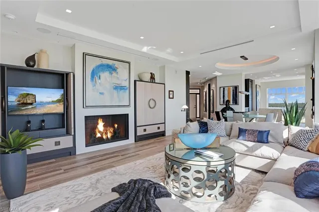 a living room with fireplace furniture and a fireplace