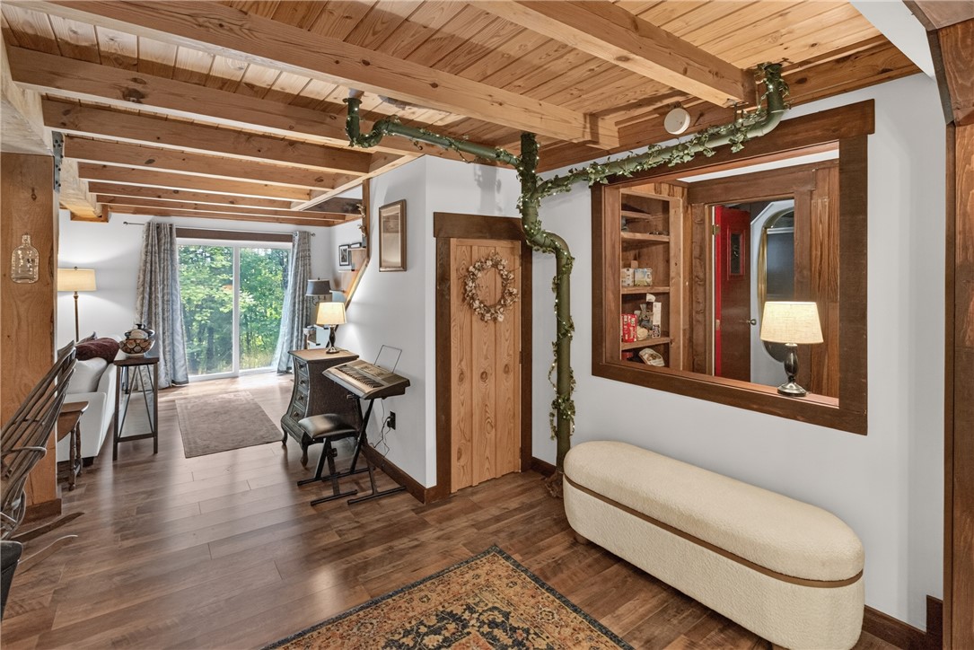 130 Maggie Rufus Lane Westminster, SC 29693 - Photo 12 of 50 Exposed beams and rich hardwood flooring create an inviting, natural aesthetic.