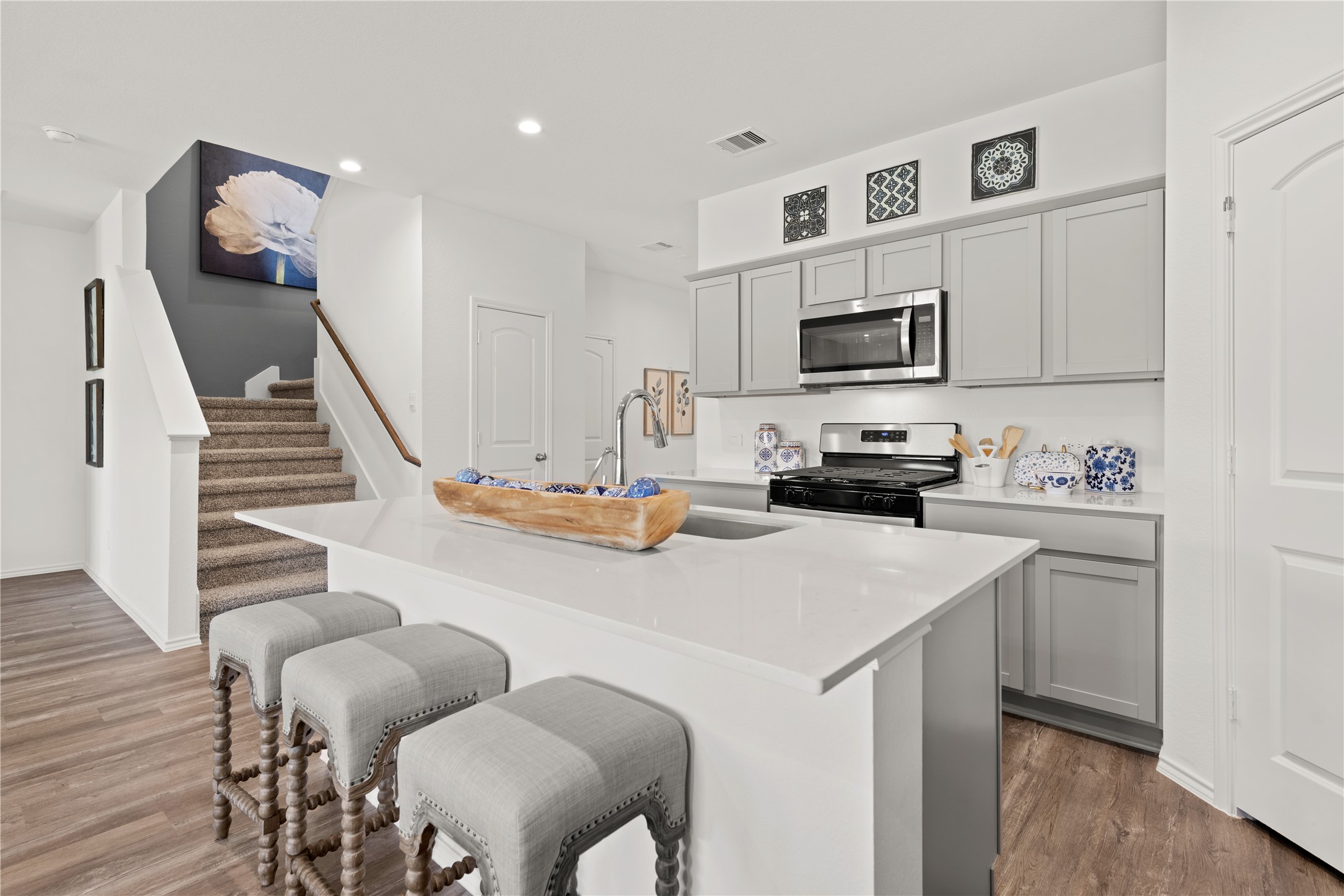 a kitchen with furniture cabinets and a window