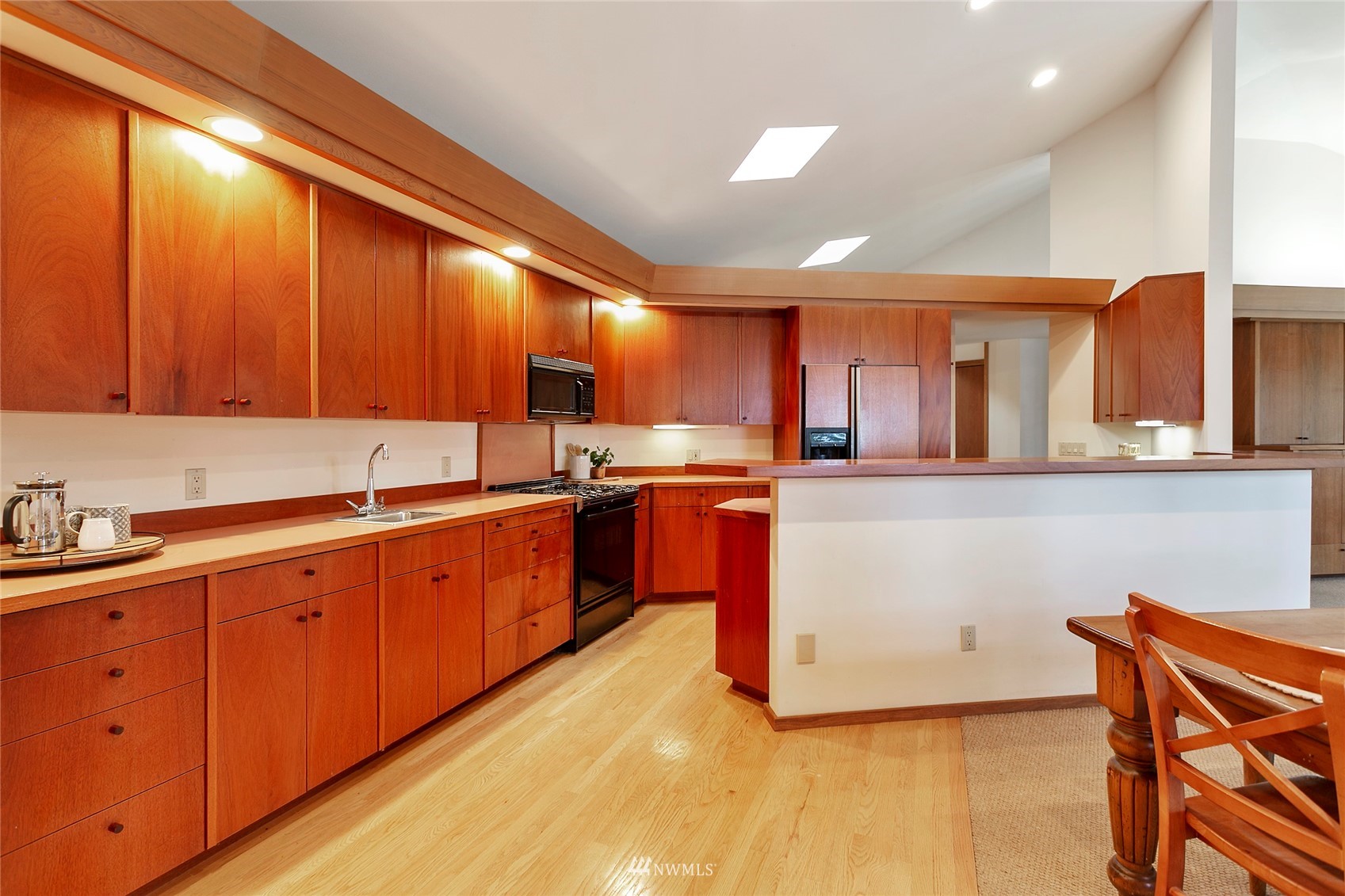312 Sea Pines Road Bellingham, WA 98229 - Photo 13 of 39 a large kitchen with stainless steel appliances wooden cabinets a sink and a stove