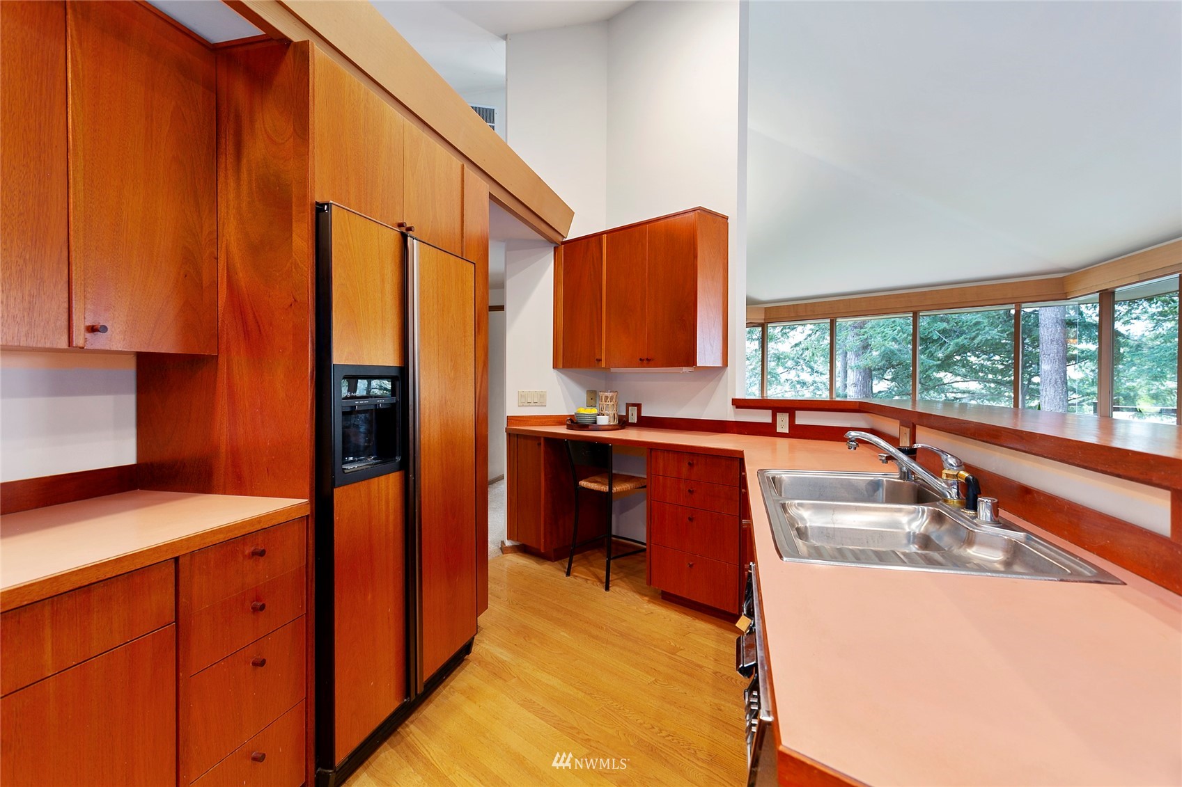 312 Sea Pines Road Bellingham, WA 98229 - Photo 18 of 39 a kitchen with kitchen island granite countertop a sink appliances cabinets and a window