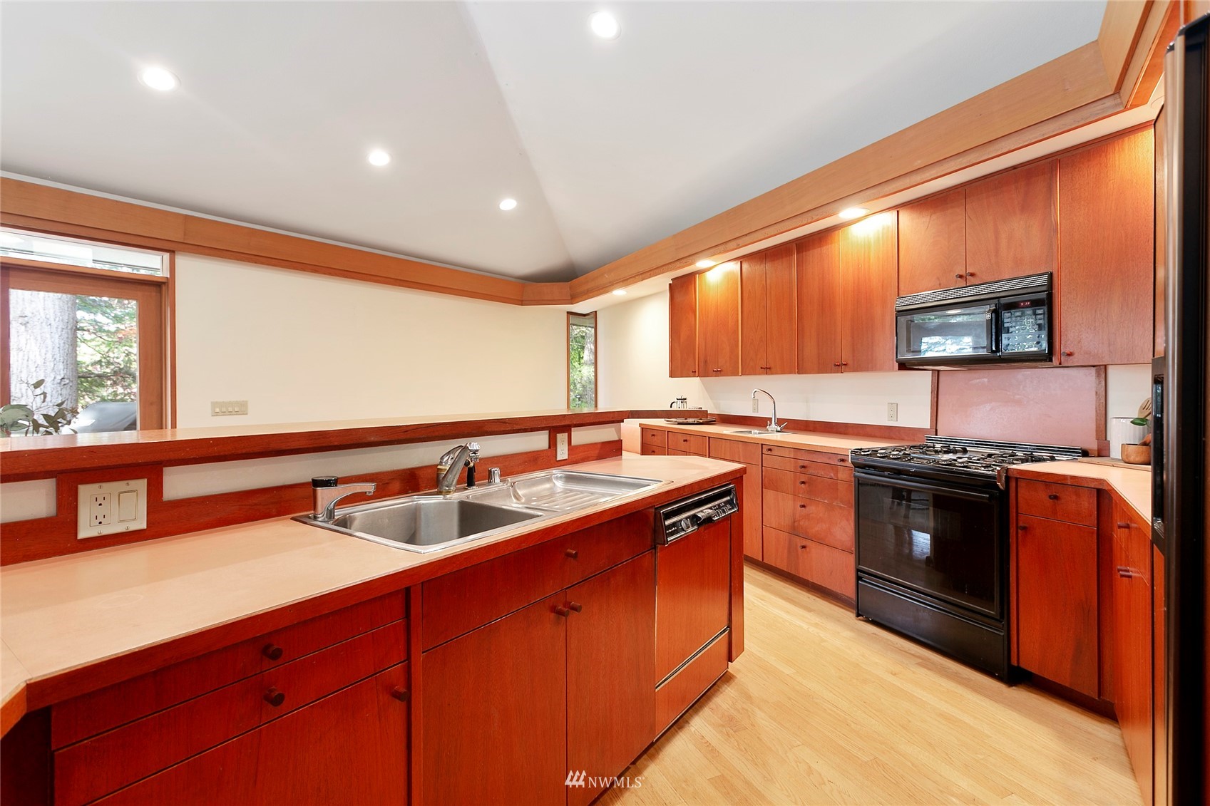312 Sea Pines Road Bellingham, WA 98229 - Photo 19 of 39 a kitchen with stainless steel appliances granite countertop a sink stove and refrigerator