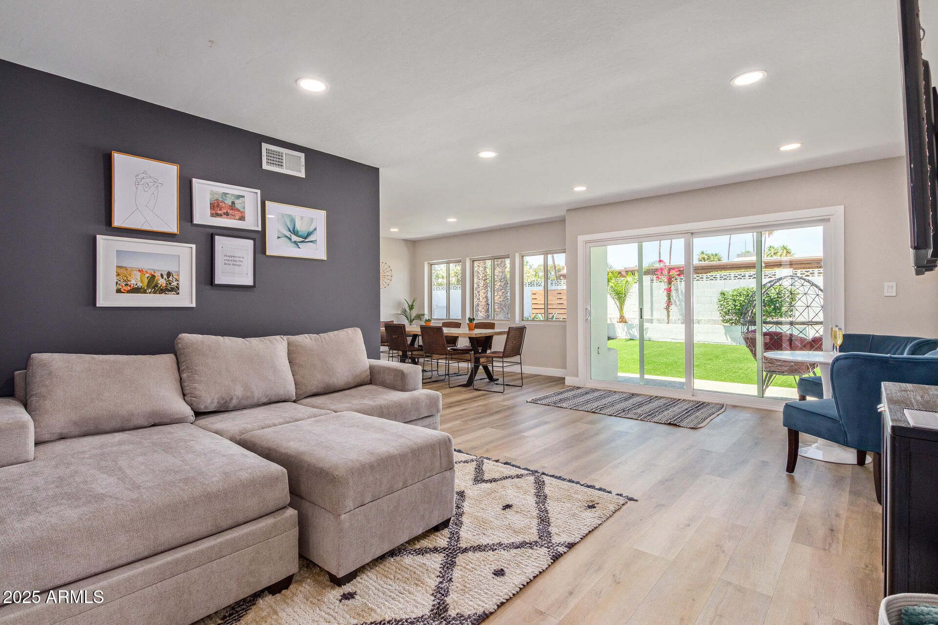 6612 East Presidio Road Scottsdale, AZ 85254 - Photo 12 of 54 a living room with furniture and large windows
