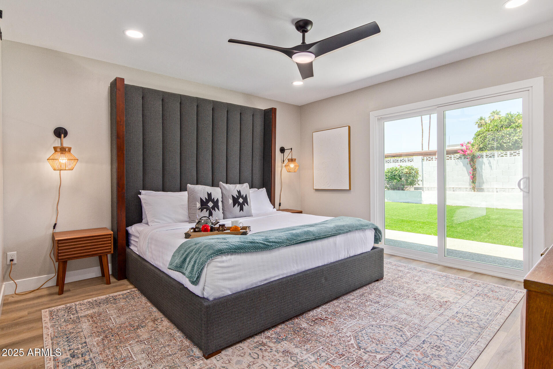 6612 East Presidio Road Scottsdale, AZ 85254 - Photo 19 of 54 a bedroom with a bed and a large window