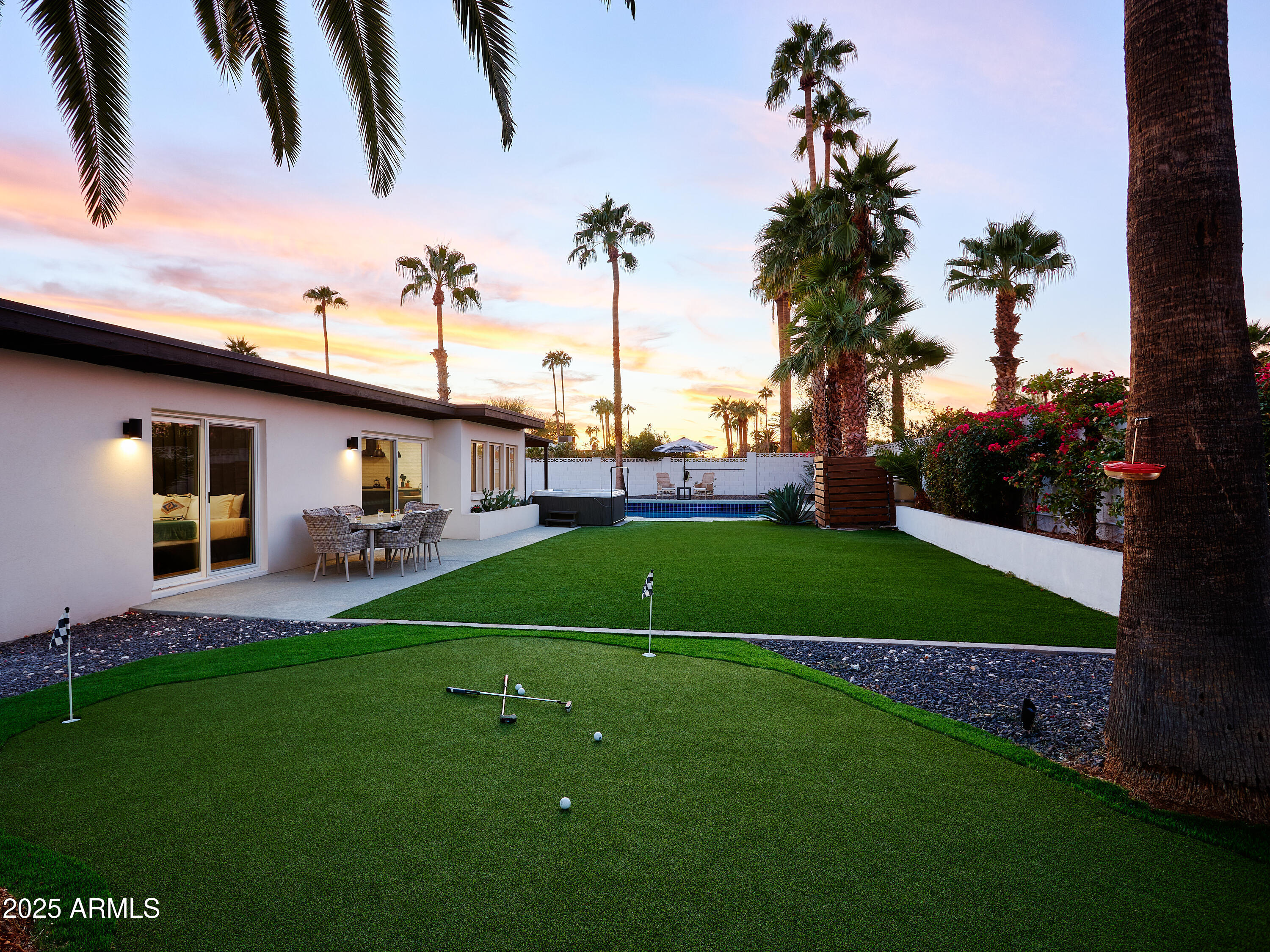 6612 East Presidio Road Scottsdale, AZ 85254 - Photo 2 of 54 a view of a house with a backyard porch and sitting area