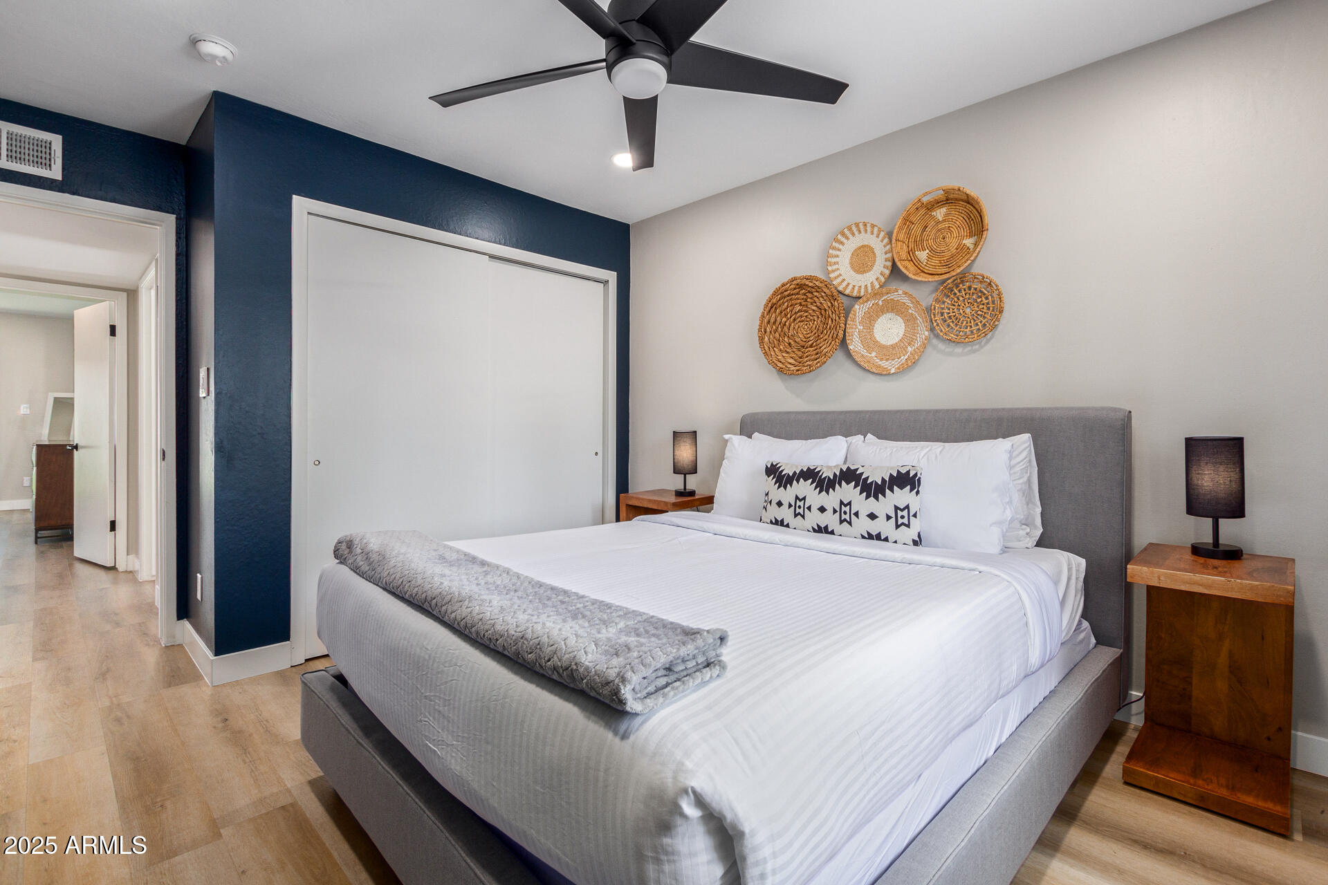 6612 East Presidio Road Scottsdale, AZ 85254 - Photo 27 of 54 a bedroom with a bed and a chandelier