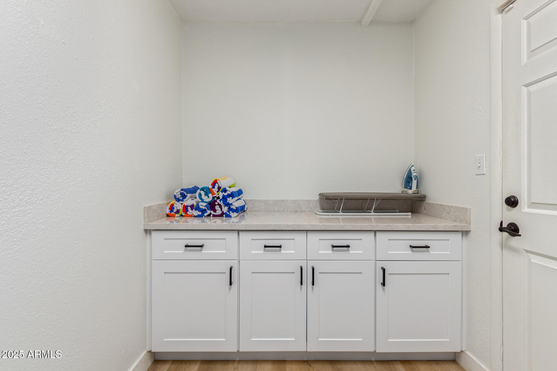 6612 East Presidio Road Scottsdale, AZ 85254 - Photo 34 of 54 a view of cabinets with wooden floor