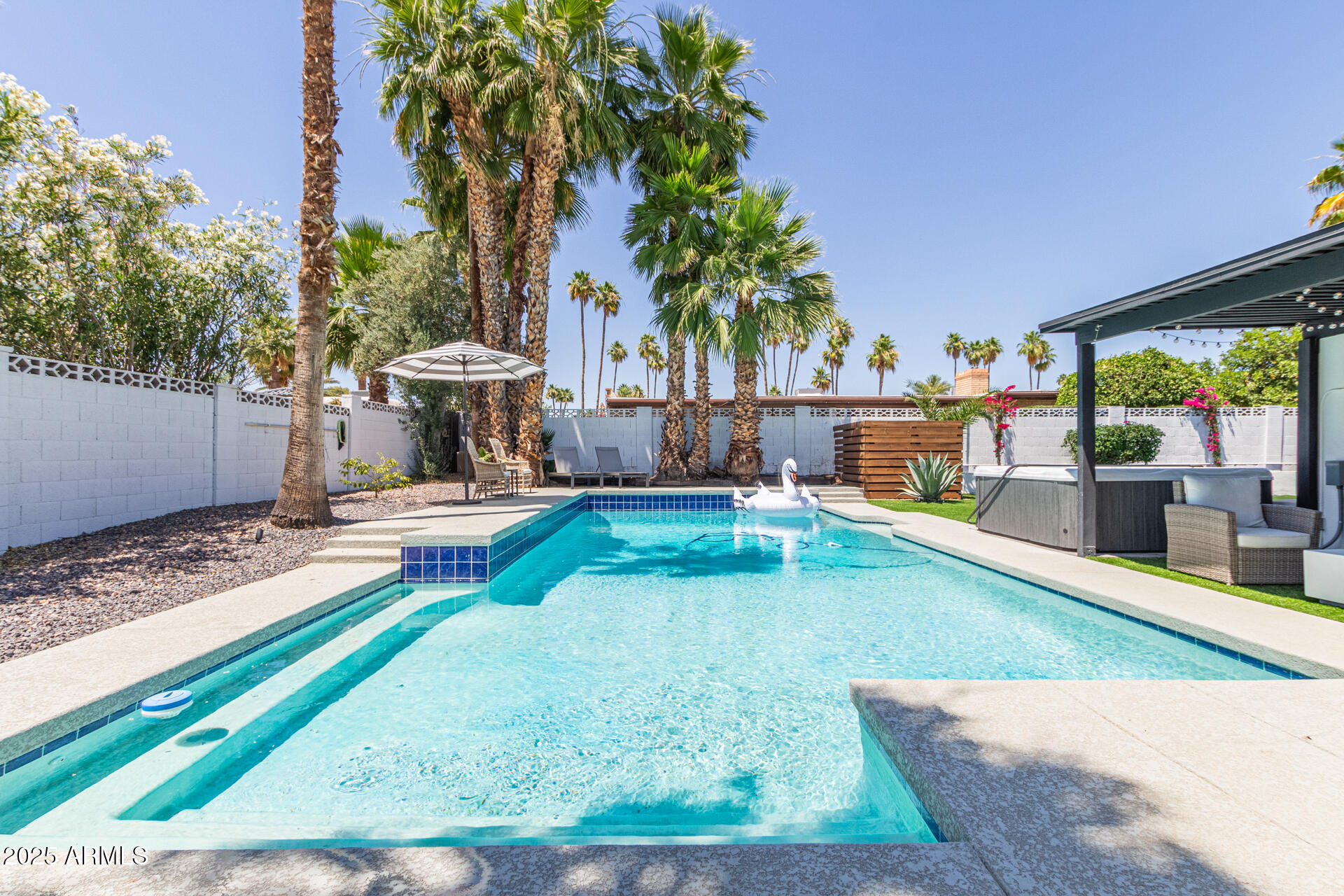 6612 East Presidio Road Scottsdale, AZ 85254 - Photo 35 of 54 a view of a swimming pool with a patio