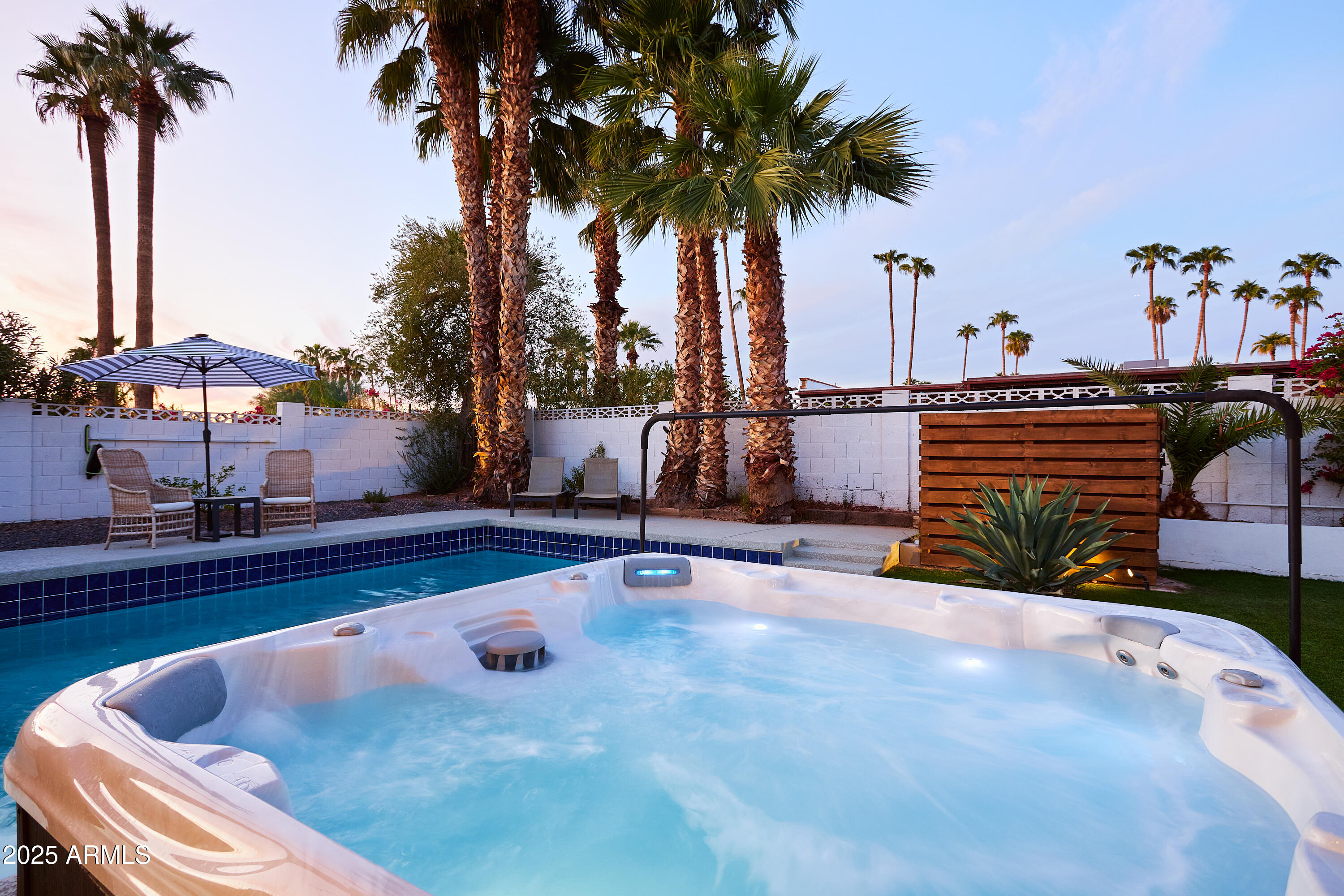 6612 East Presidio Road Scottsdale, AZ 85254 - Photo 4 of 54 a view of swimming pool with a table and chairs