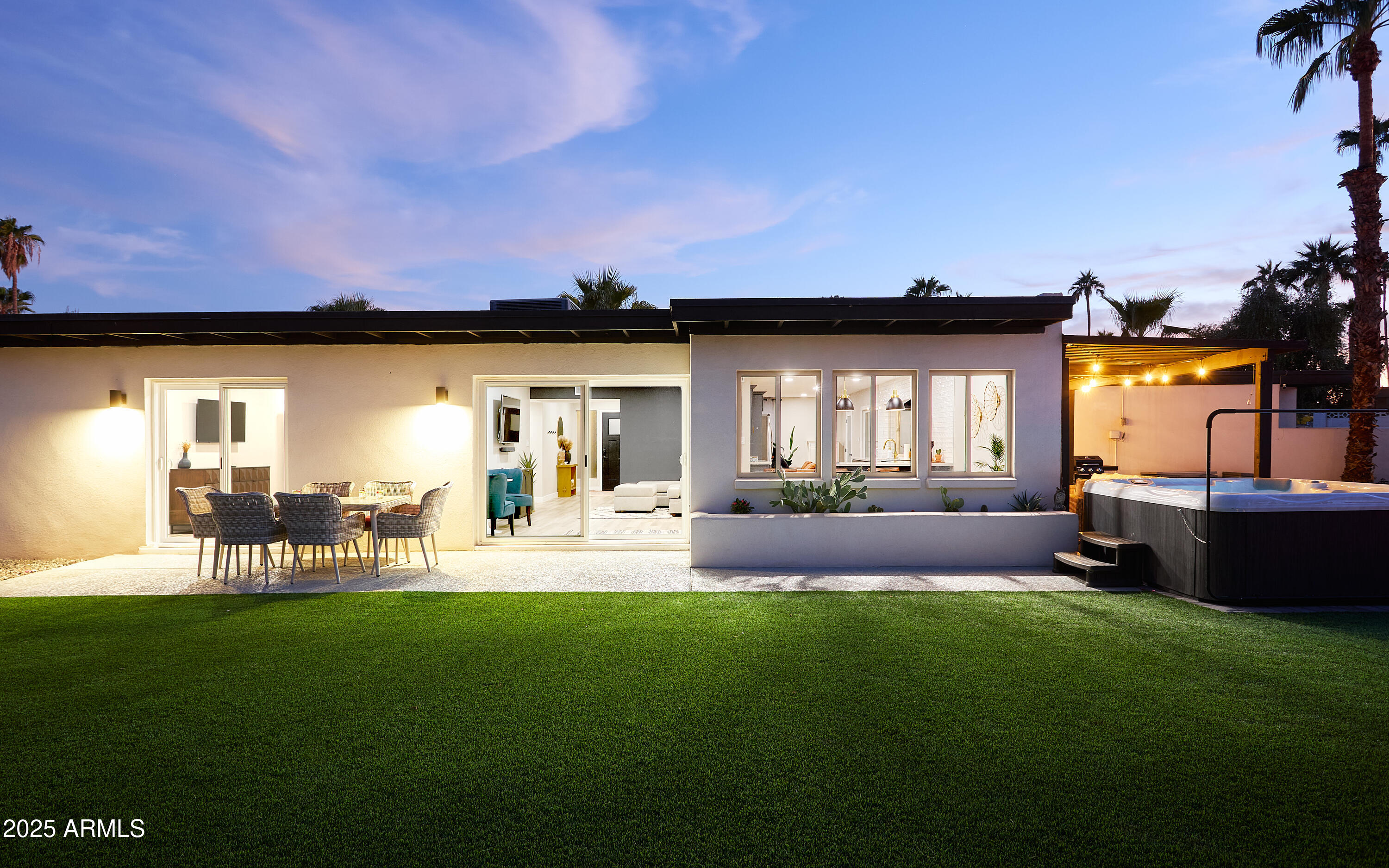 6612 East Presidio Road Scottsdale, AZ 85254 - Photo 51 of 54 a living room with furniture a rug and a yard