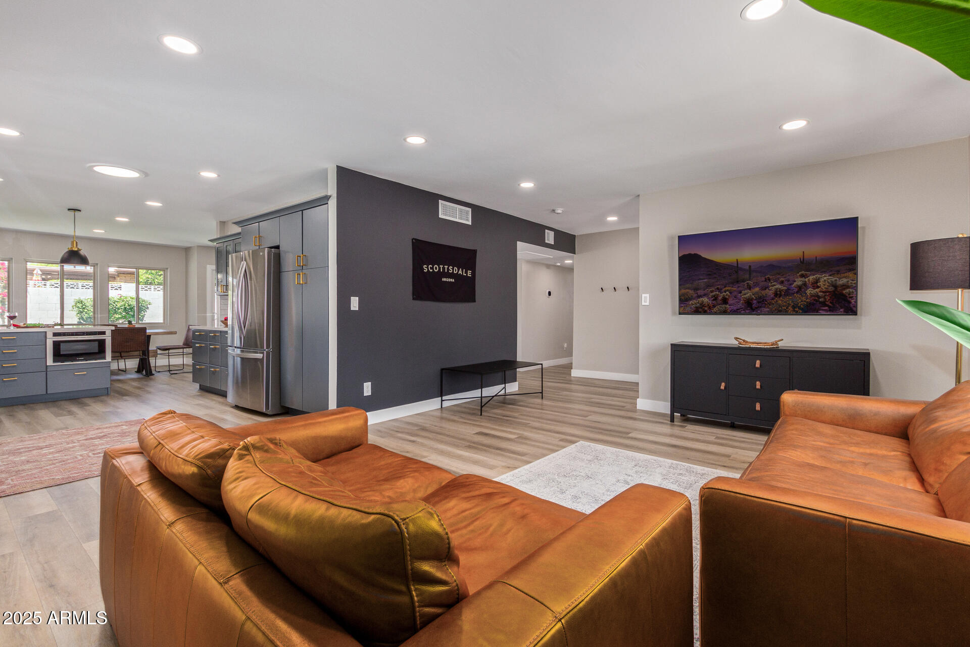 6612 East Presidio Road Scottsdale, AZ 85254 - Photo 7 of 54 a living room with furniture and a flat screen tv