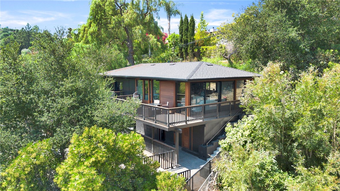 4009 Weslin Avenue Sherman Oaks, CA 91423 - Photo 1 of 44 a view of a patio with table and chairs under an umbrella