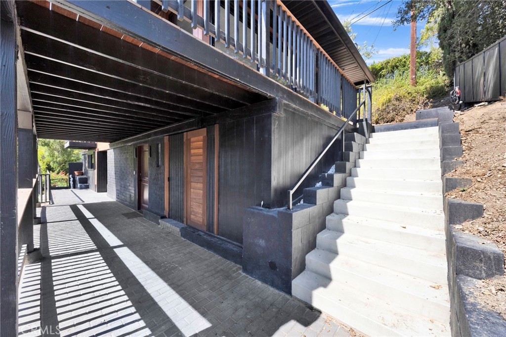 4009 Weslin Avenue Sherman Oaks, CA 91423 - Photo 23 of 44 a view of a balcony with wooden floor and stairs