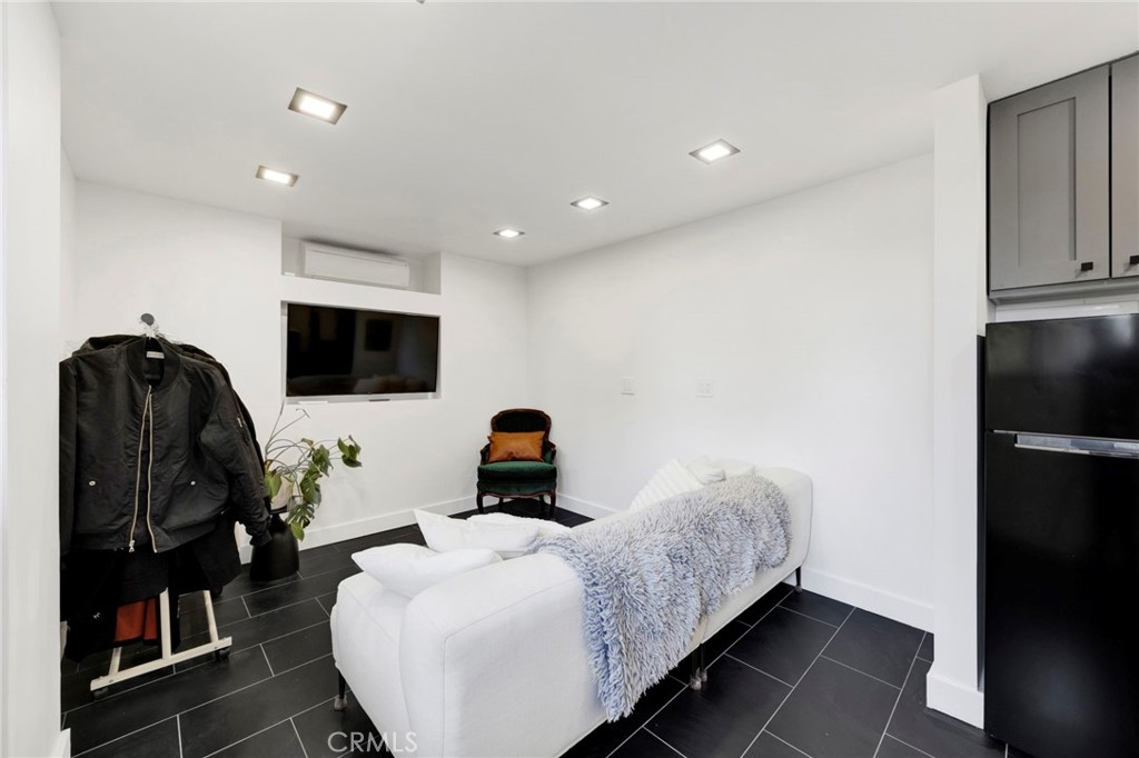 4009 Weslin Avenue Sherman Oaks, CA 91423 - Photo 26 of 44 a living room with furniture and a flat screen tv