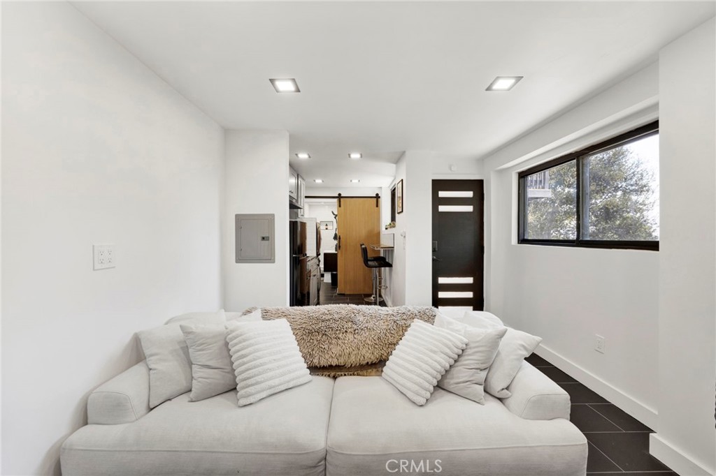 4009 Weslin Avenue Sherman Oaks, CA 91423 - Photo 27 of 44 a living room with furniture and a large window