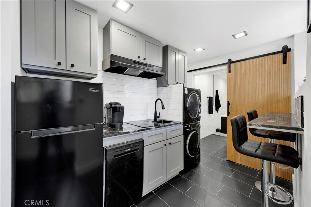 4009 Weslin Avenue Sherman Oaks, CA 91423 - Photo 28 of 44 a kitchen with stainless steel appliances granite countertop a refrigerator sink and cabinets