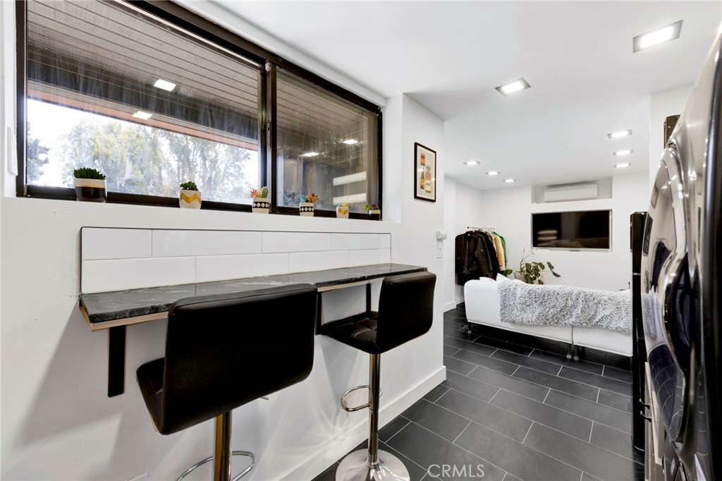 4009 Weslin Avenue Sherman Oaks, CA 91423 - Photo 29 of 44 a large white kitchen with a large window