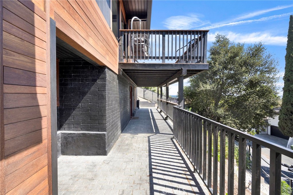 4009 Weslin Avenue Sherman Oaks, CA 91423 - Photo 33 of 44 a view of a balcony with wooden floor and stairs