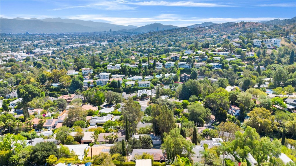 4009 Weslin Avenue Sherman Oaks, CA 91423 - Photo 42 of 44 an aerial view of a houses with a lush green hillside