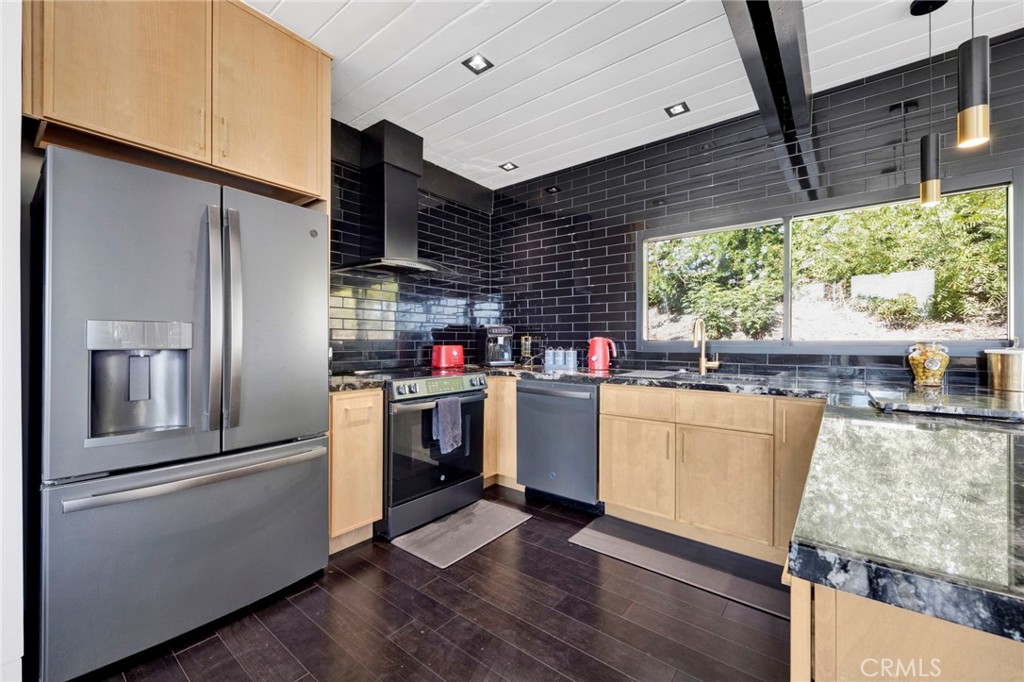 4009 Weslin Avenue Sherman Oaks, CA 91423 - Photo 8 of 44 a kitchen with refrigerator and window