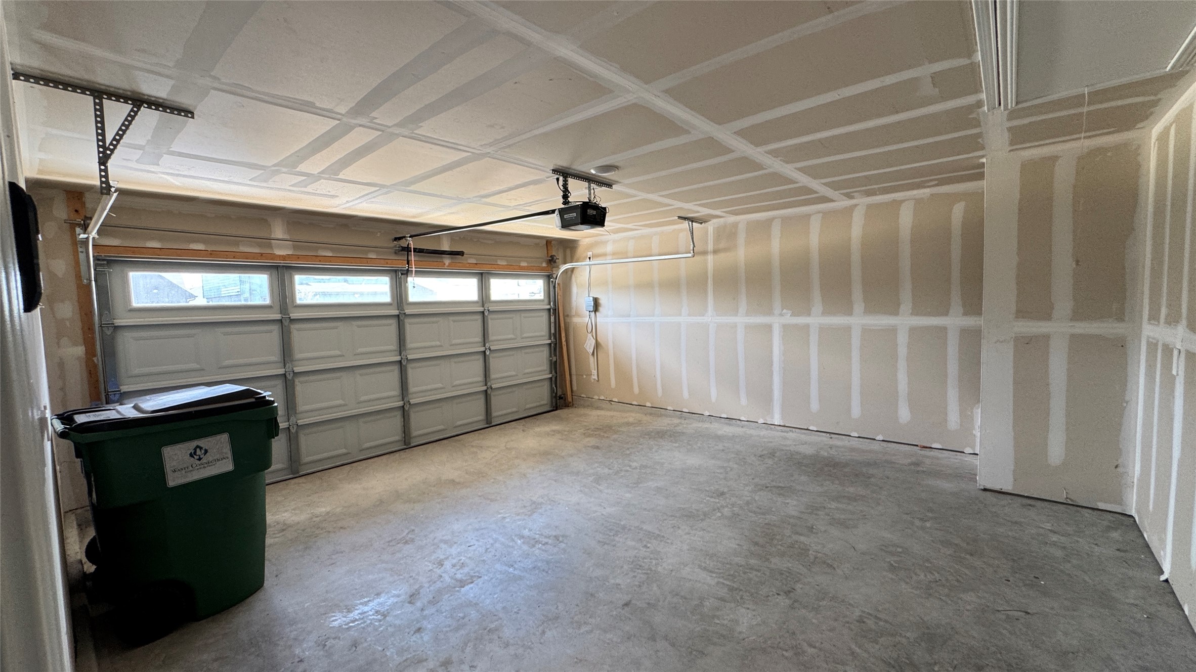 408 Frogmore Loop Kyle, TX 78640 - Photo 25 of 32 A spacious, newly constructed garage ready for personalization and vehicle storage.