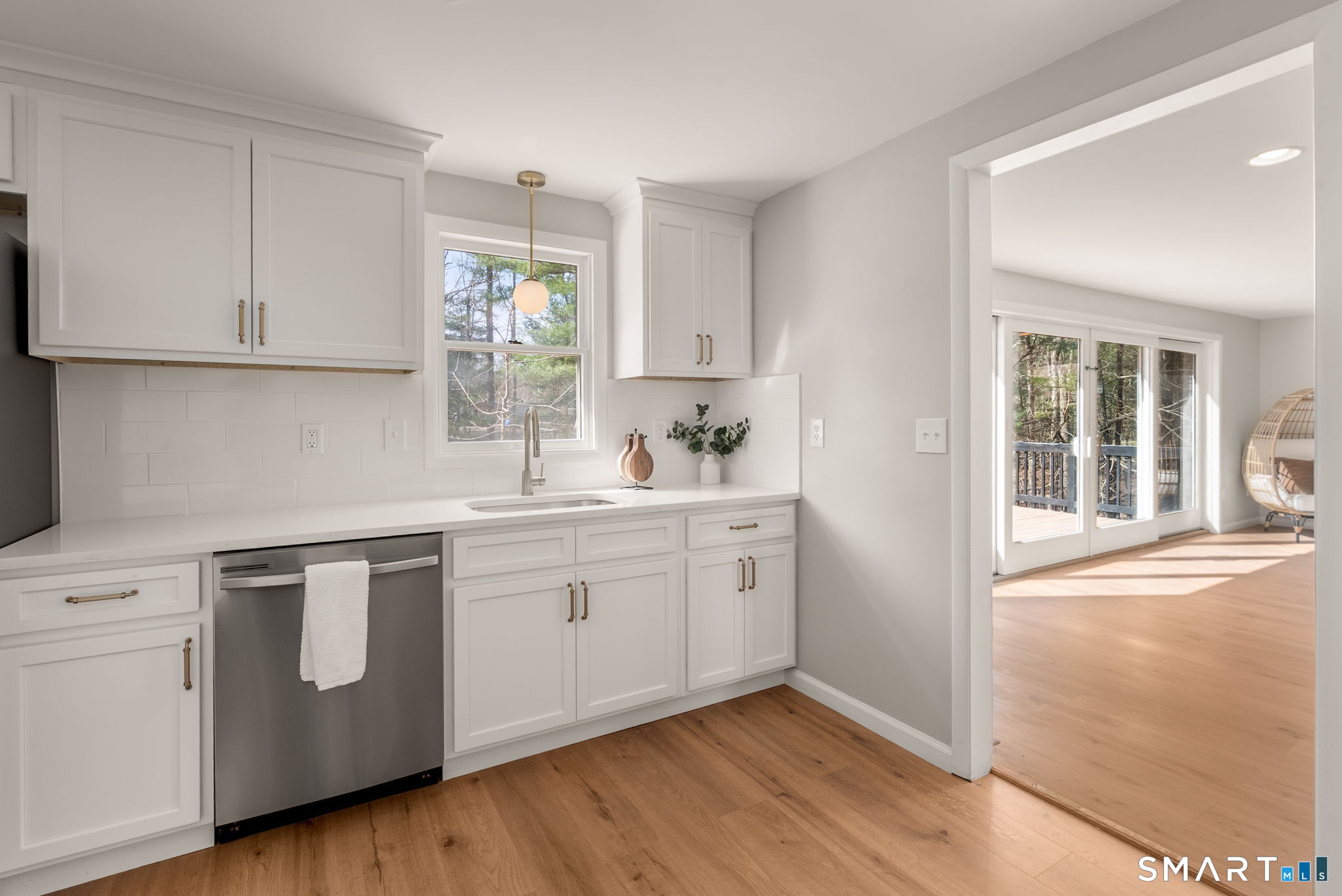 89 Bradway Road Stafford, CT 06076 - Photo 11 of 39 a kitchen with granite countertop white cabinets and white appliances