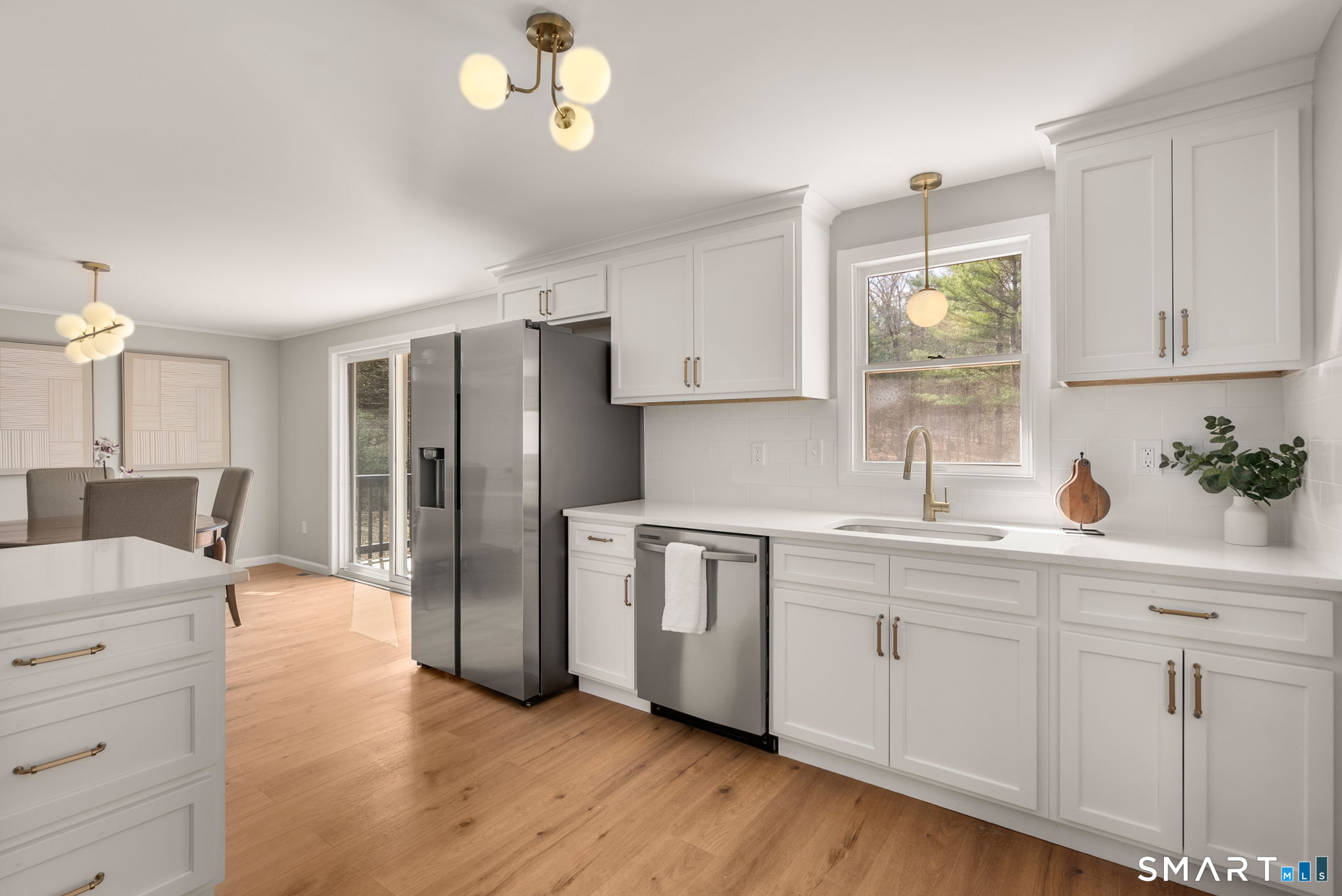 89 Bradway Road Stafford, CT 06076 - Photo 12 of 39 a kitchen with stainless steel appliances a refrigerator sink and cabinets