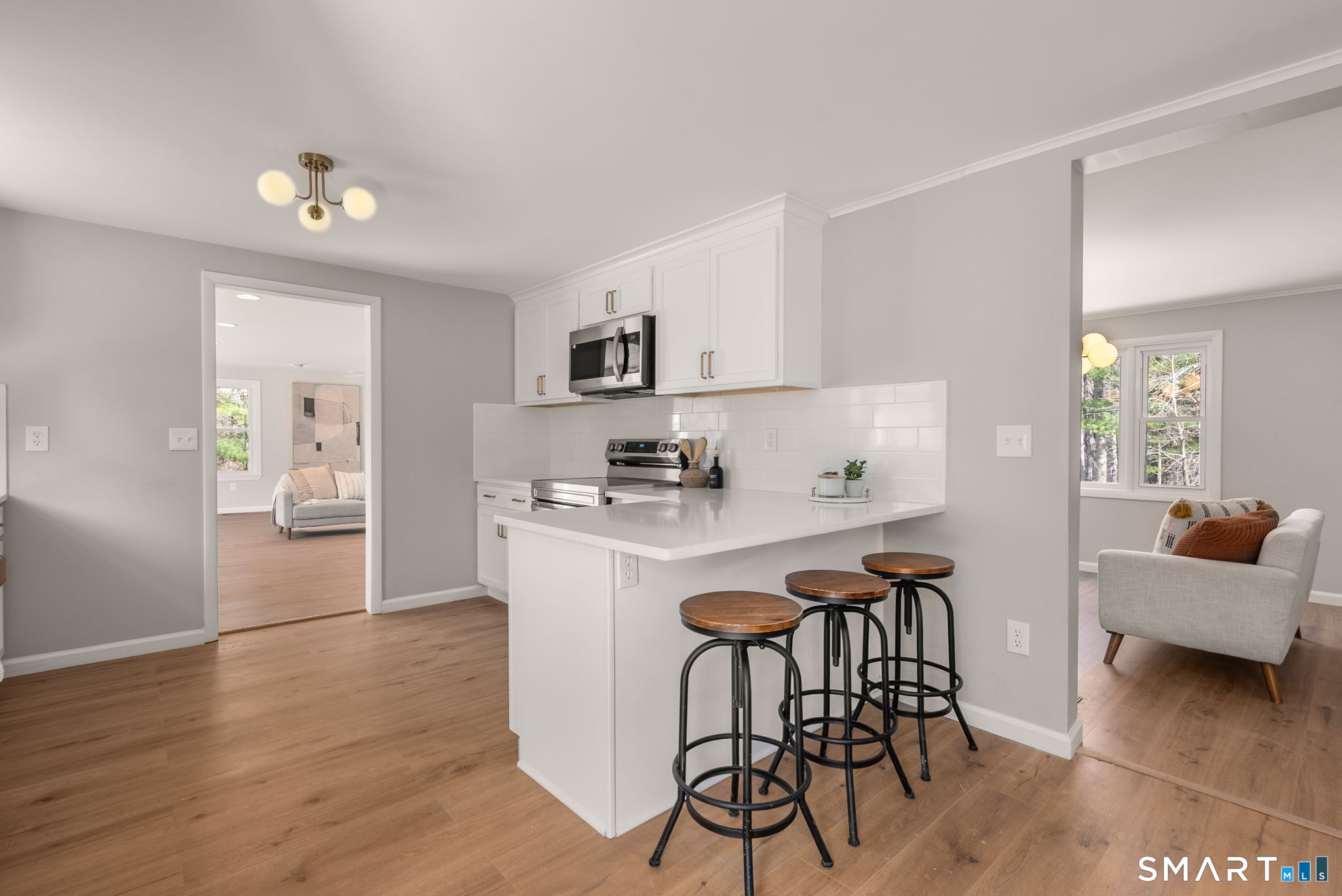 89 Bradway Road Stafford, CT 06076 - Photo 16 of 39 a kitchen with a table and chairs in it