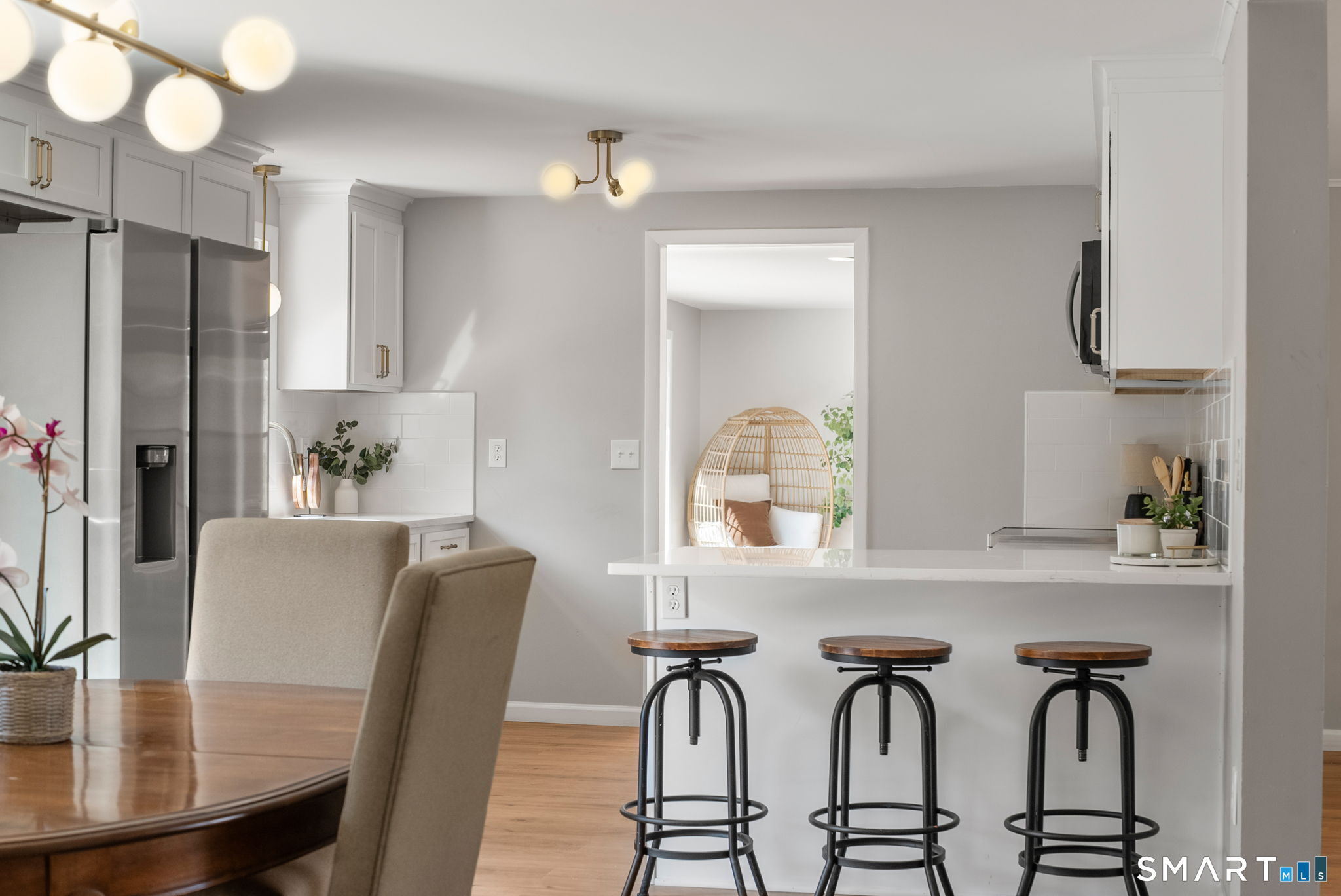 89 Bradway Road Stafford, CT 06076 - Photo 17 of 39 a view of a dining room with furniture and a chandelier