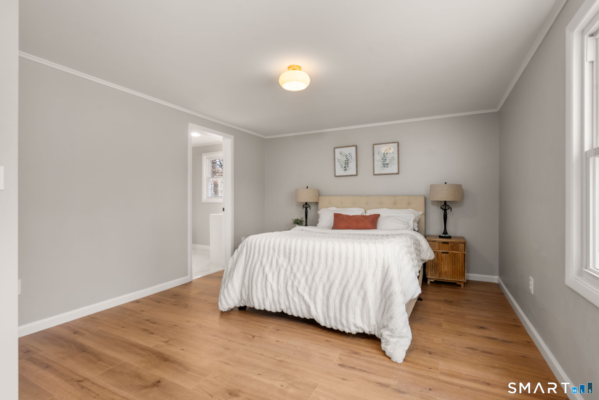 89 Bradway Road Stafford, CT 06076 - Photo 25 of 39 a bedroom with a bed and a lamp on dresser