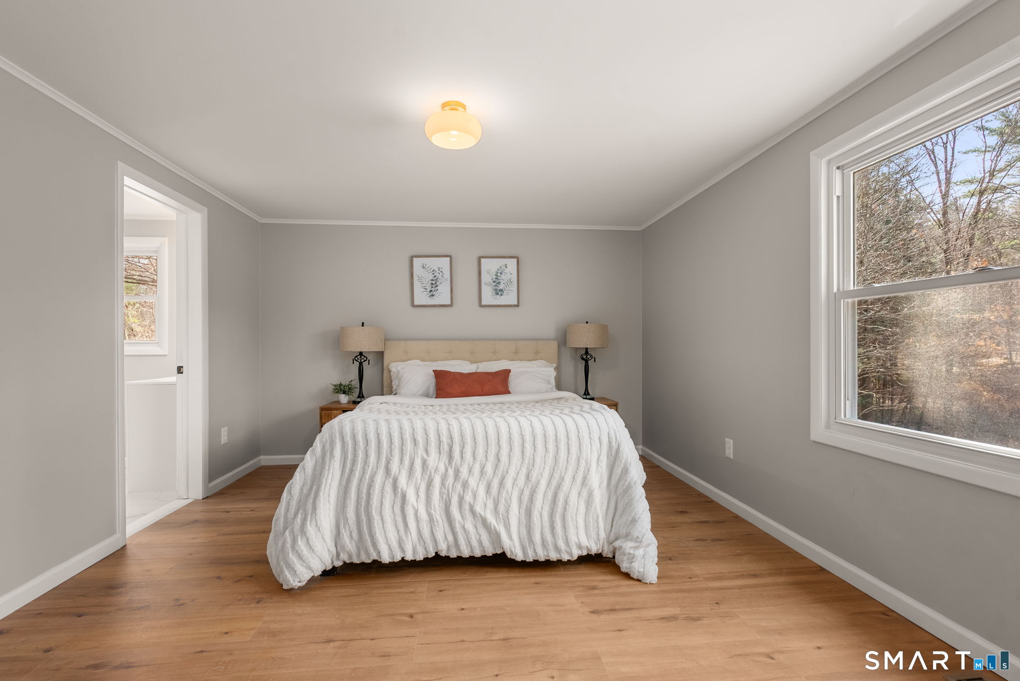 89 Bradway Road Stafford, CT 06076 - Photo 27 of 39 a bedroom with a bed and wooden floor