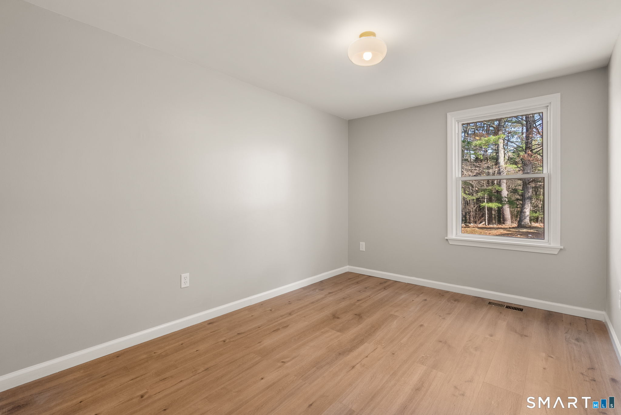 89 Bradway Road Stafford, CT 06076 - Photo 29 of 39 wooden floor in an empty room with a window
