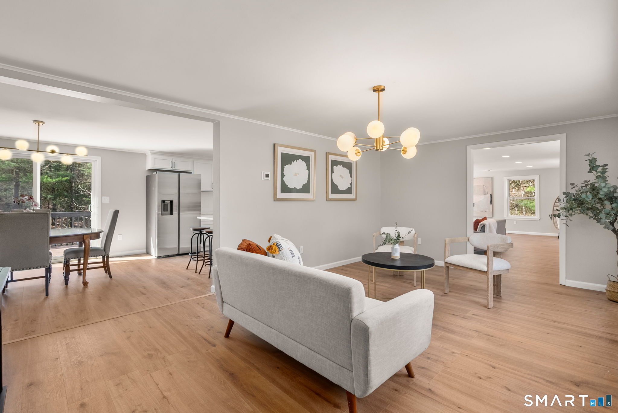89 Bradway Road Stafford, CT 06076 - Photo 3 of 39 a living room with couches a table and chairs
