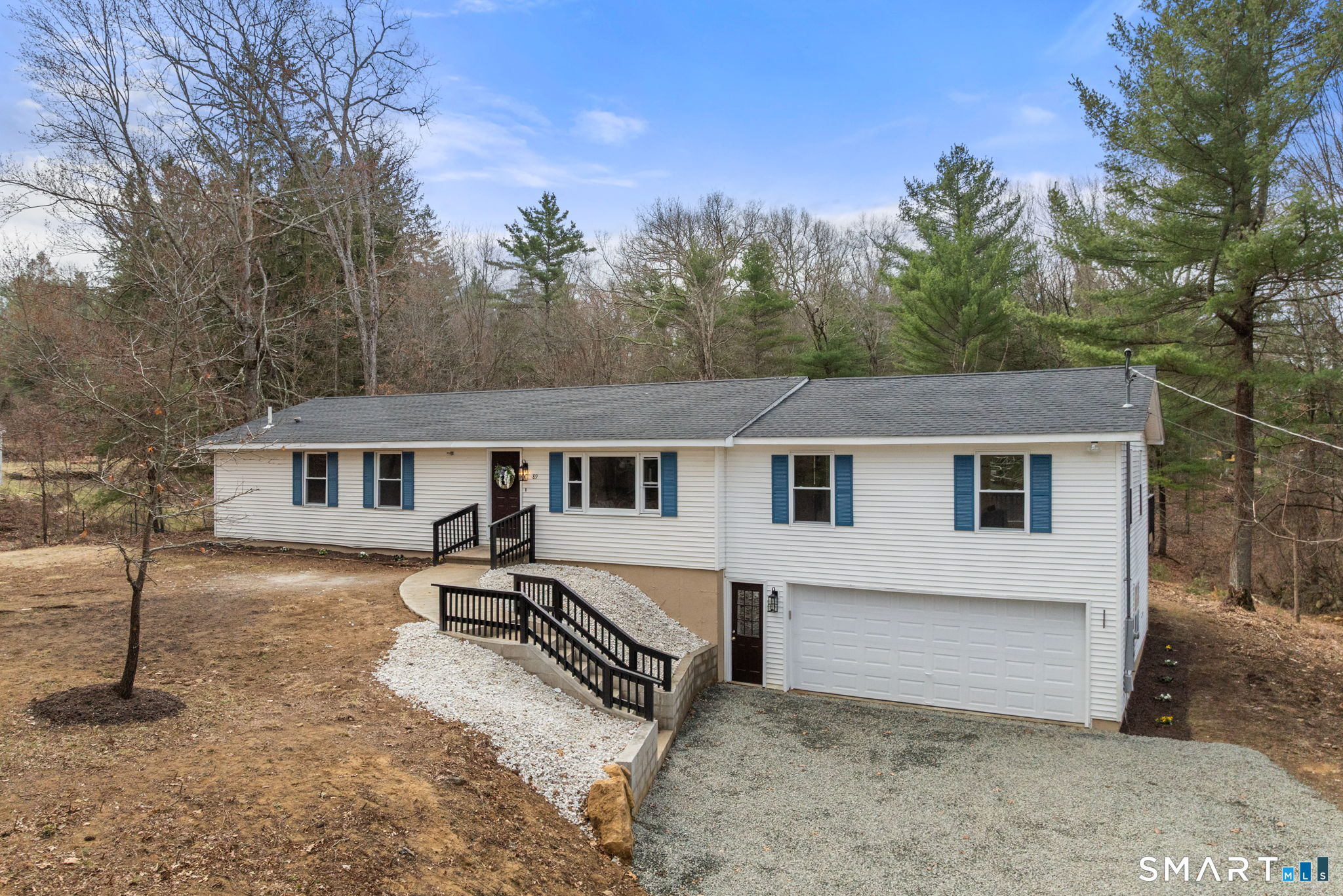 89 Bradway Road Stafford, CT 06076 - Photo 39 of 39 a house that has tree in front of it