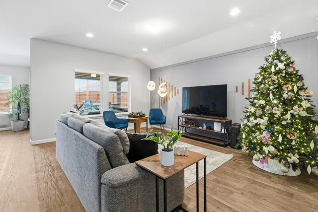 a view of a dining room with furniture and wooden floor